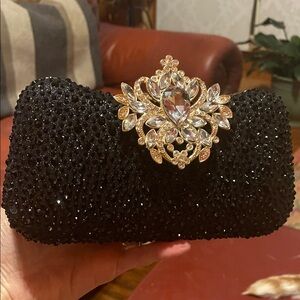 Glamorous Black Clutch with Gold Crystal Accent
